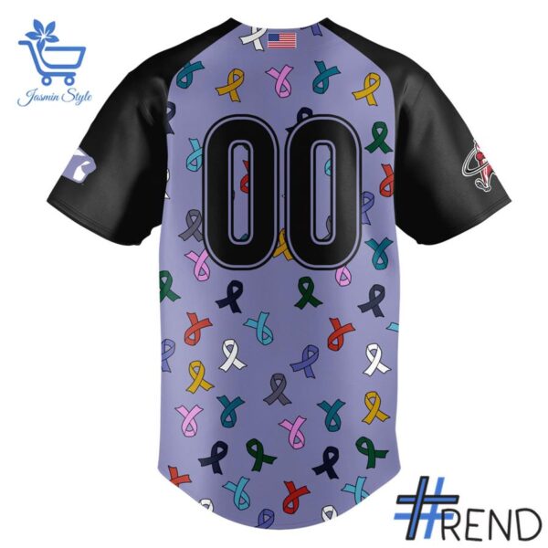 Detailed view of the 3 Macon Bacon Strike Out Cancer Jerseys print on fabric