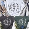 The 1 Halloween Party Dancing Skeletons Shirt brings street-ready confidence to everyday outfits.