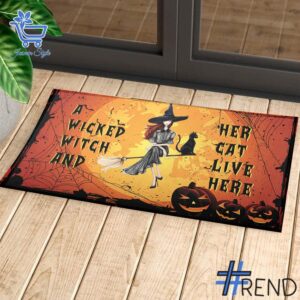 Take on every challenge with the A Wicked Witch And Her Cat Live Here Witch Doormat.
